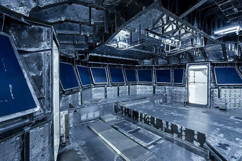 a large room with a lot of pipes and a door aboard PINK SHADOW Yacht for Sale