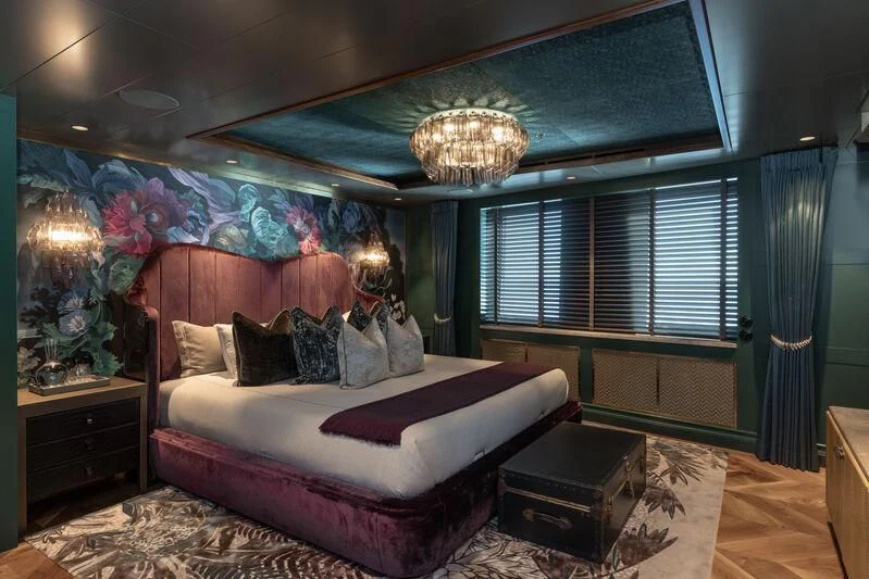 a bedroom with a large bed aboard PINK SHADOW Yacht for Sale