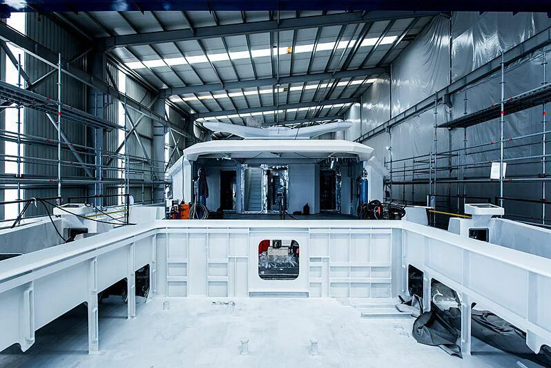 a large room with a white wall aboard PINK SHADOW Yacht for Sale