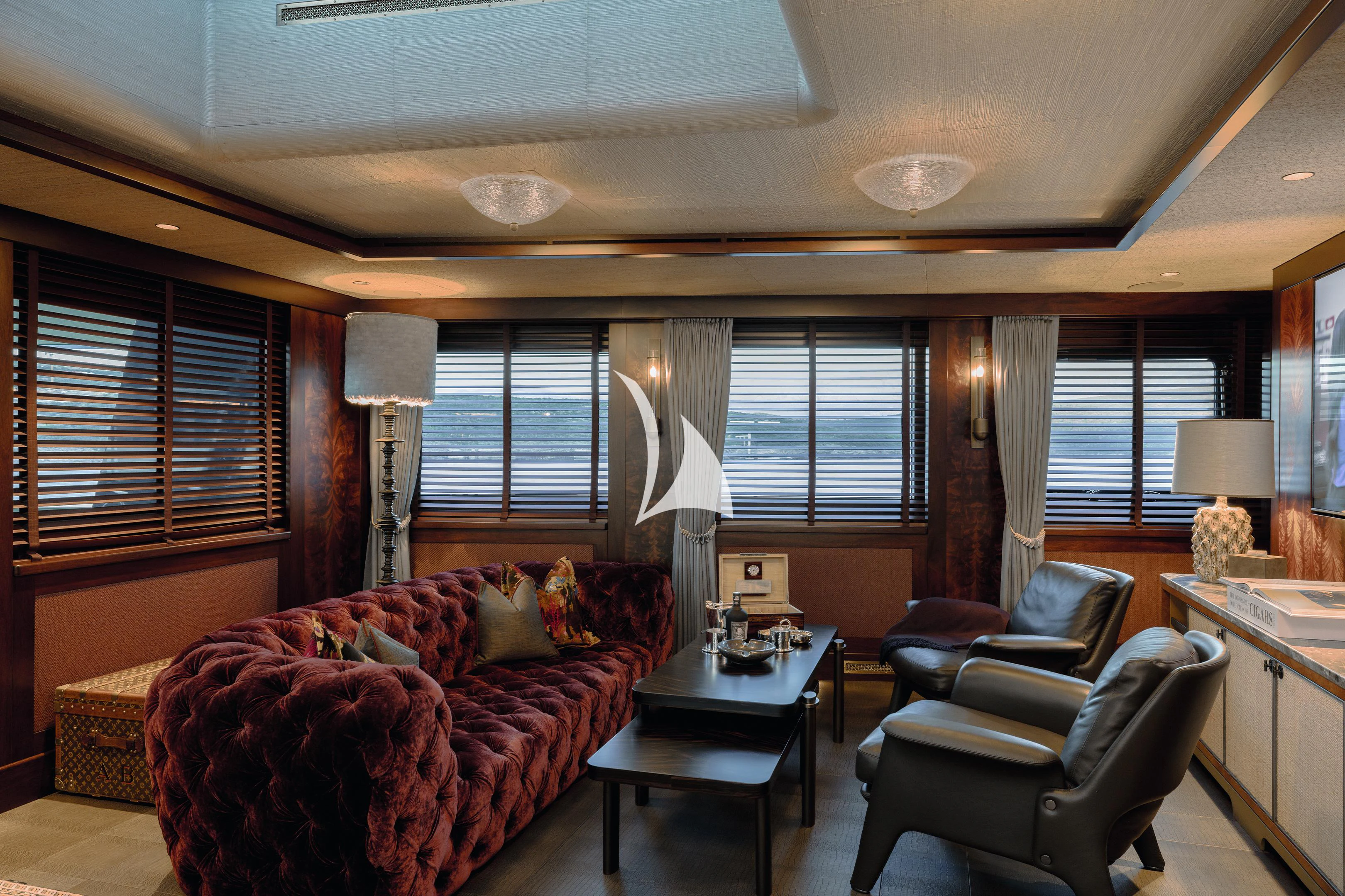 a living room with a couch and a coffee table aboard PINK SHADOW Yacht for Sale