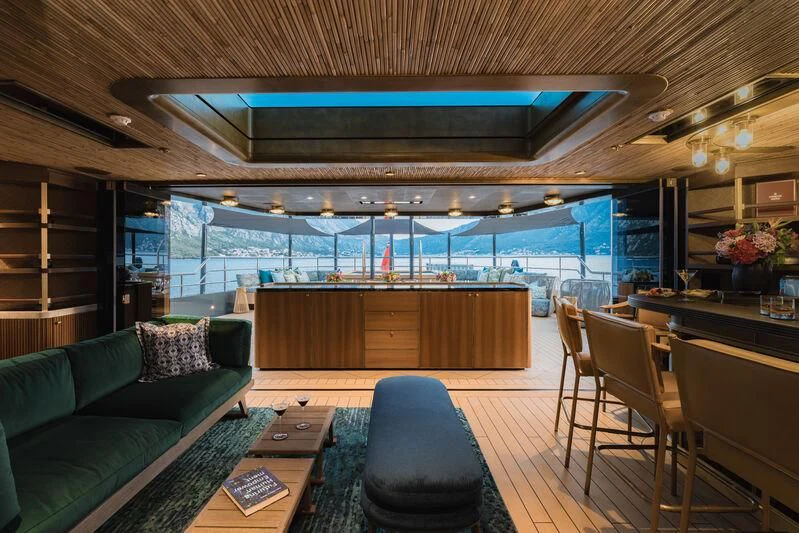 a room with a couch and a table and chairs aboard PINK SHADOW Yacht for Sale