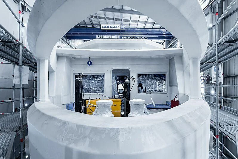 a large white building with a large white table and chairs aboard PINK SHADOW Yacht for Sale