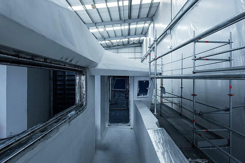 a white room with a few windows aboard PINK SHADOW Yacht for Sale