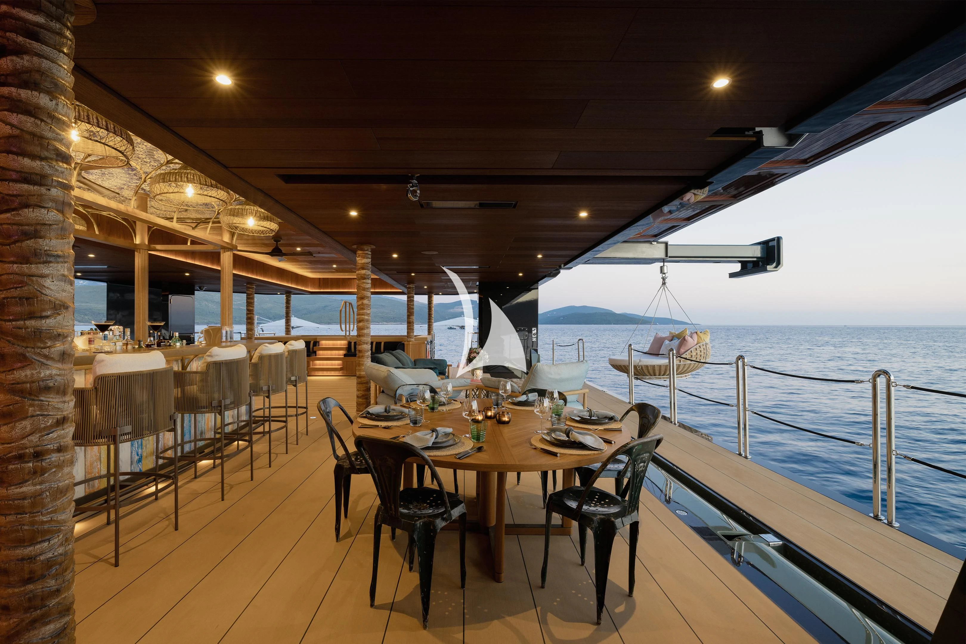 a deck with tables and chairs aboard PINK SHADOW Yacht for Sale