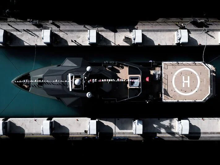 a large black airplane aboard PINK SHADOW Yacht for Sale