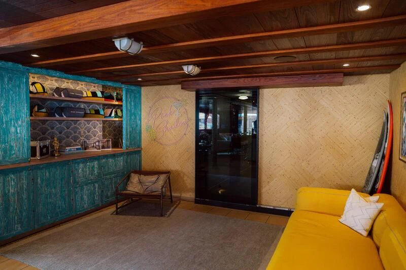 a room with a couch and a chair aboard PINK SHADOW Yacht for Sale