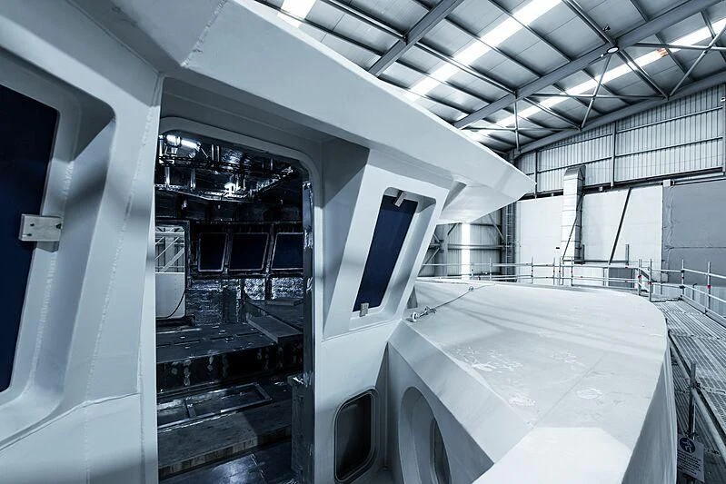 a room with a large white table and chairs and a large window aboard PINK SHADOW Yacht for Sale