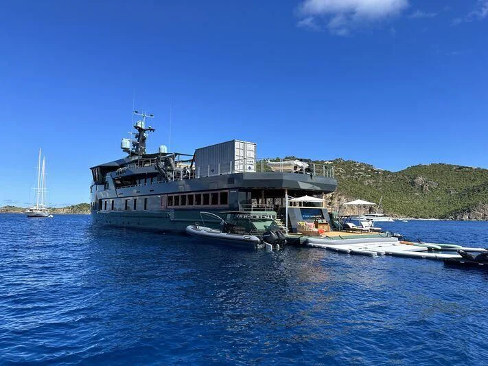 a boat docked at a pier aboard PINK SHADOW Yacht for Sale