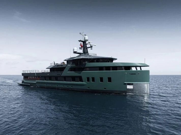 a large green boat in the water aboard PINK SHADOW Yacht for Sale