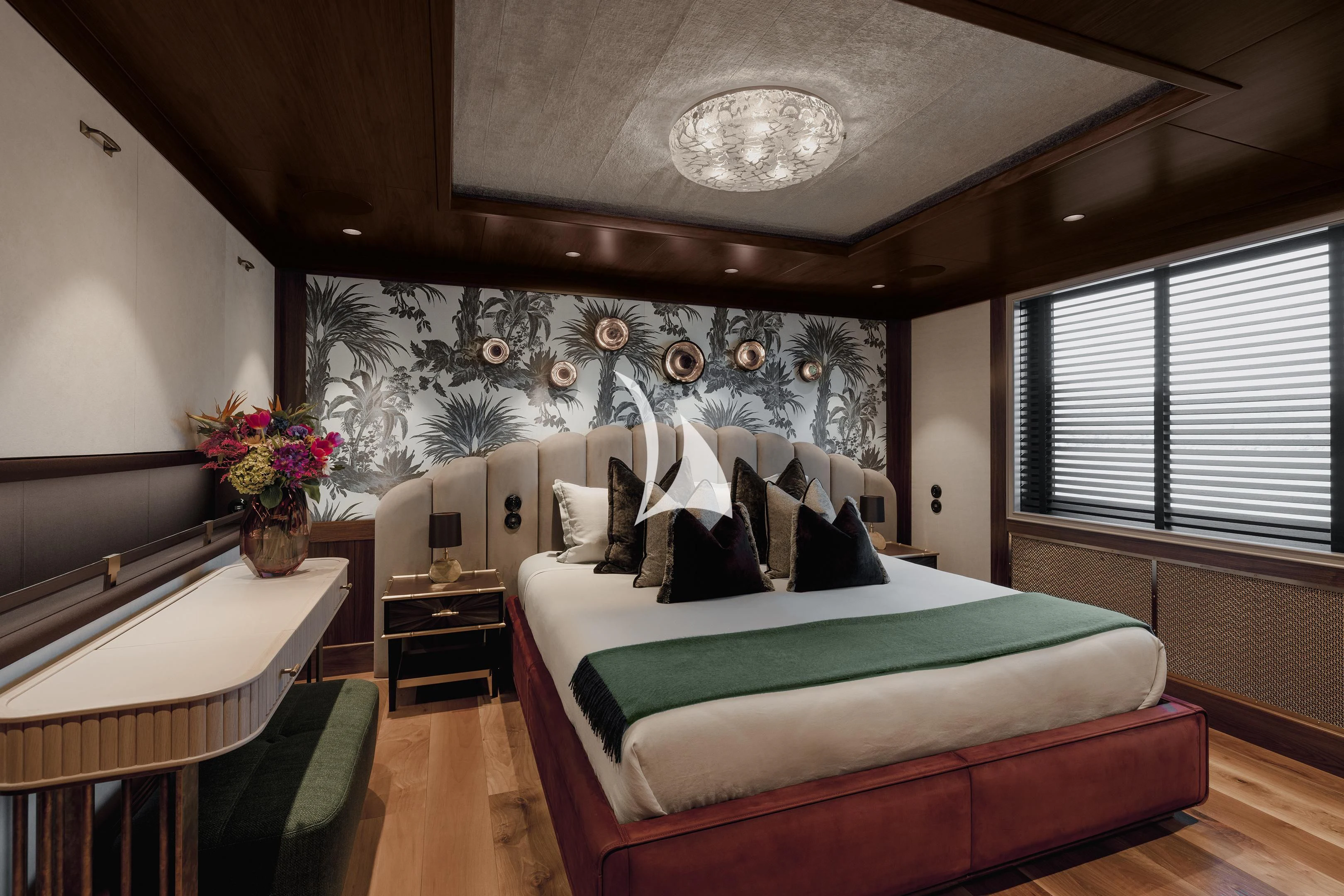 a bedroom with a bed and a table aboard PINK SHADOW Yacht for Sale