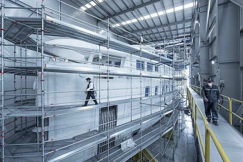 a few people in a large room aboard PINK SHADOW Yacht for Sale