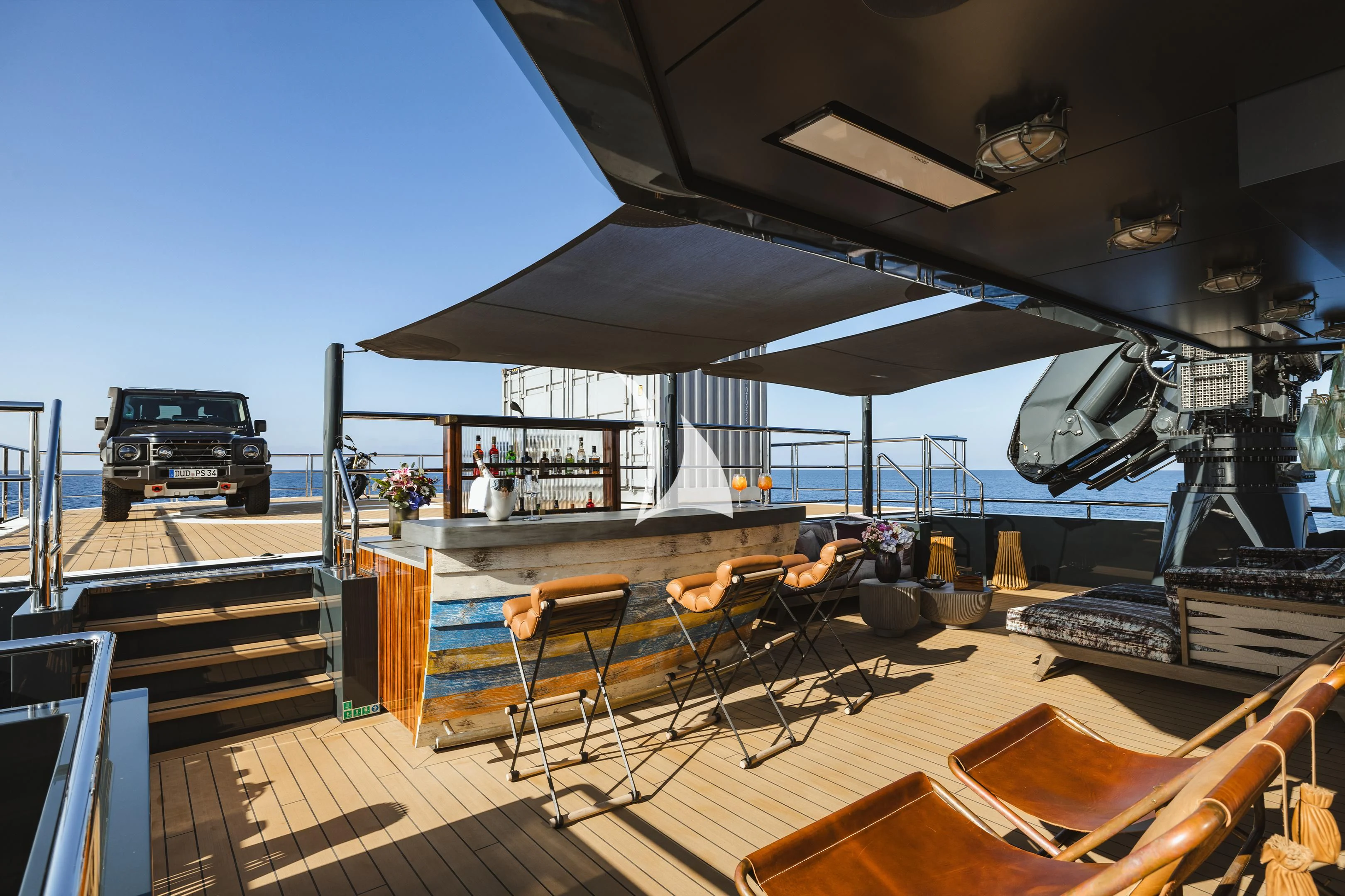 a large umbrella sits on top of a table aboard PINK SHADOW Yacht for Sale