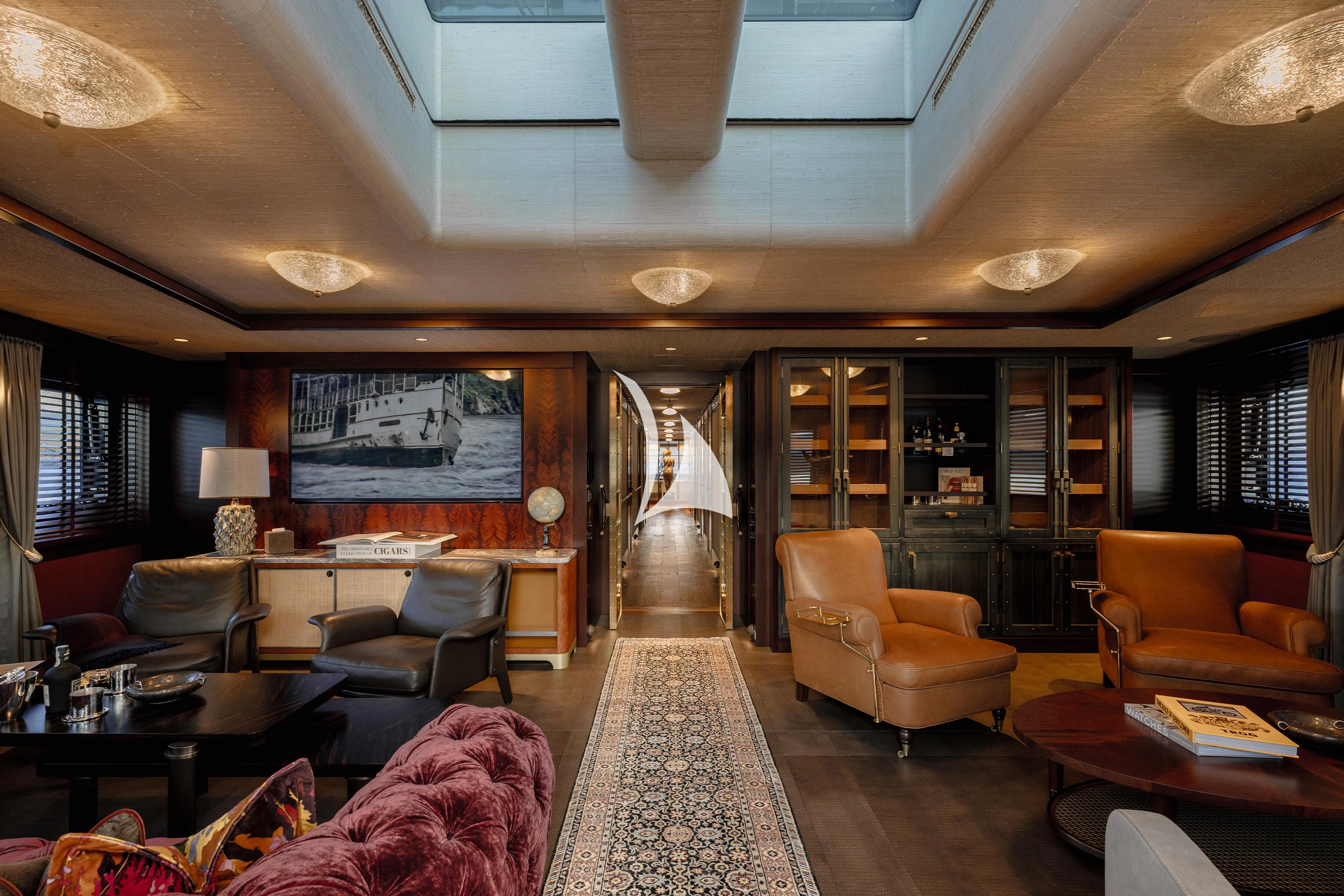 a living room with a large glass door aboard PINK SHADOW Yacht for Sale