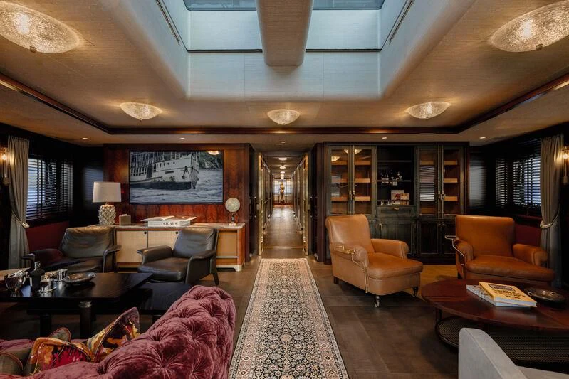 a living room with a large glass door aboard PINK SHADOW Yacht for Sale