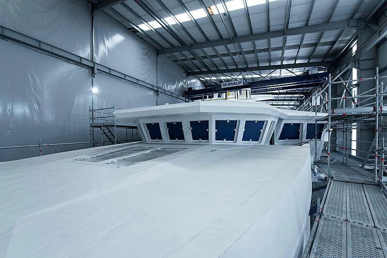 a white train in a train station aboard PINK SHADOW Yacht for Sale