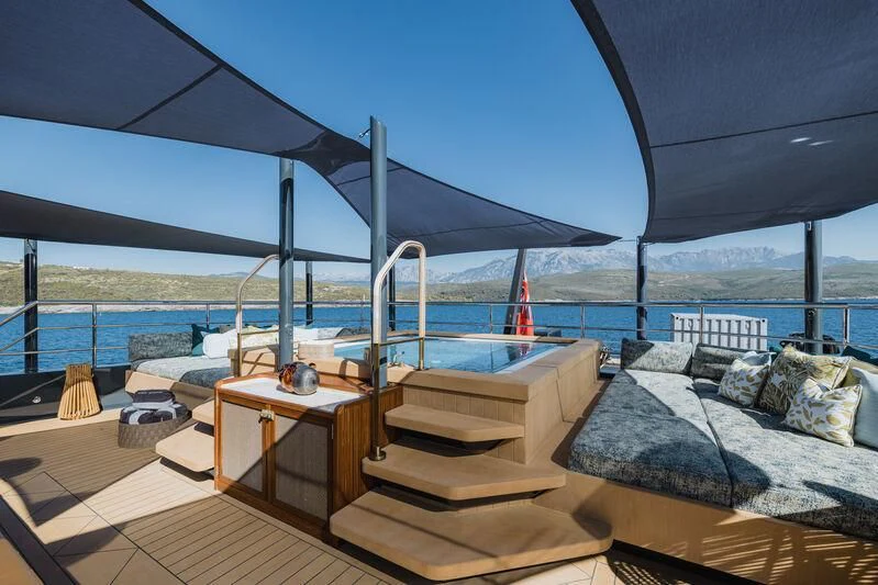 a bed on a deck aboard PINK SHADOW Yacht for Sale