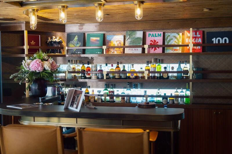 a bar with a laptop and a laptop on it aboard PINK SHADOW Yacht for Sale