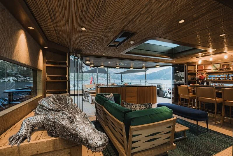 a room with a bed and a couch aboard PINK SHADOW Yacht for Sale