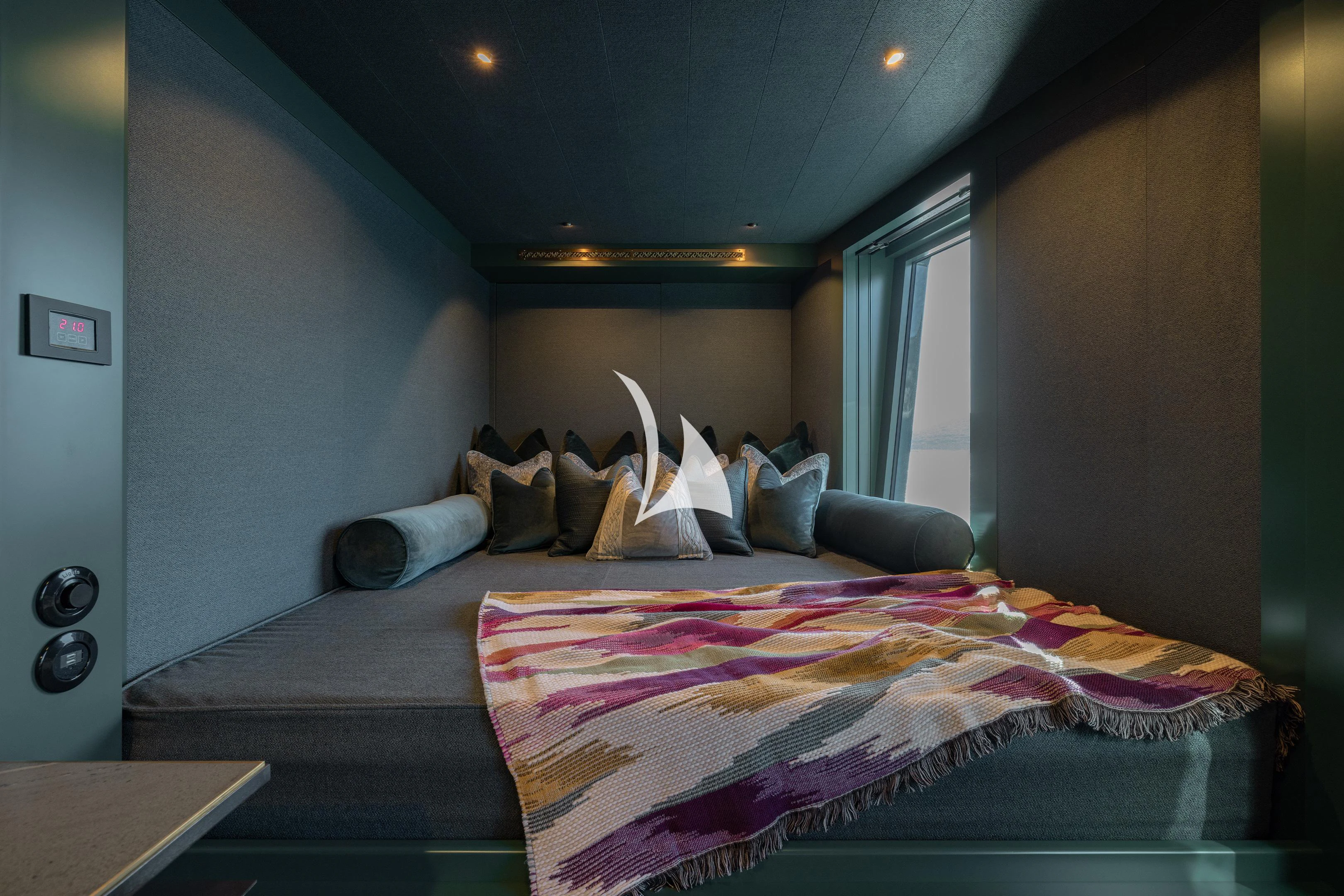 a bedroom with a bed and a window aboard PINK SHADOW Yacht for Sale