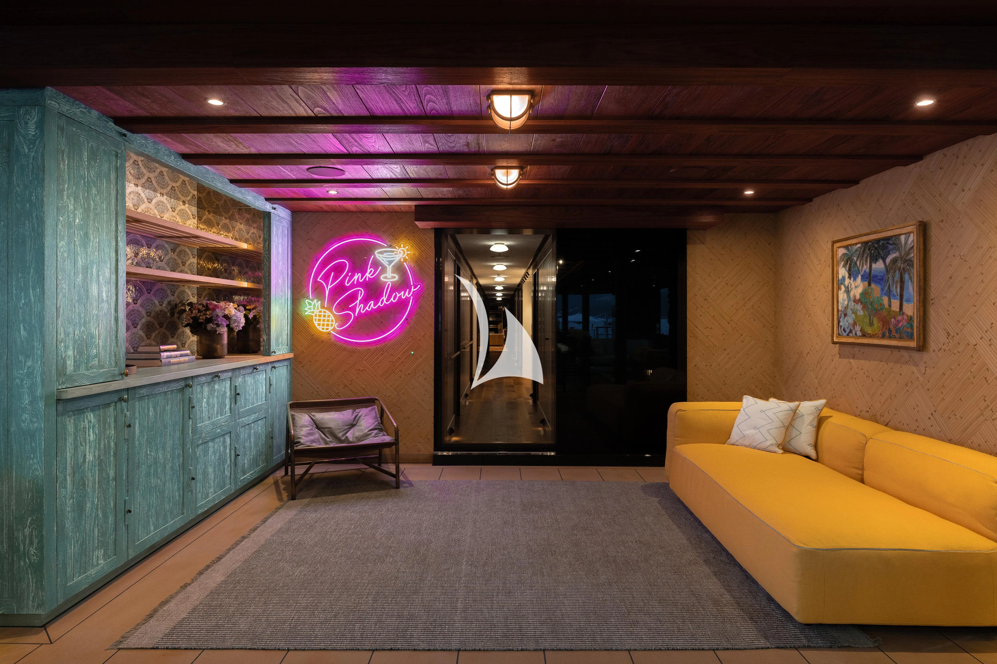 a living room with a couch and a door aboard PINK SHADOW Yacht for Sale