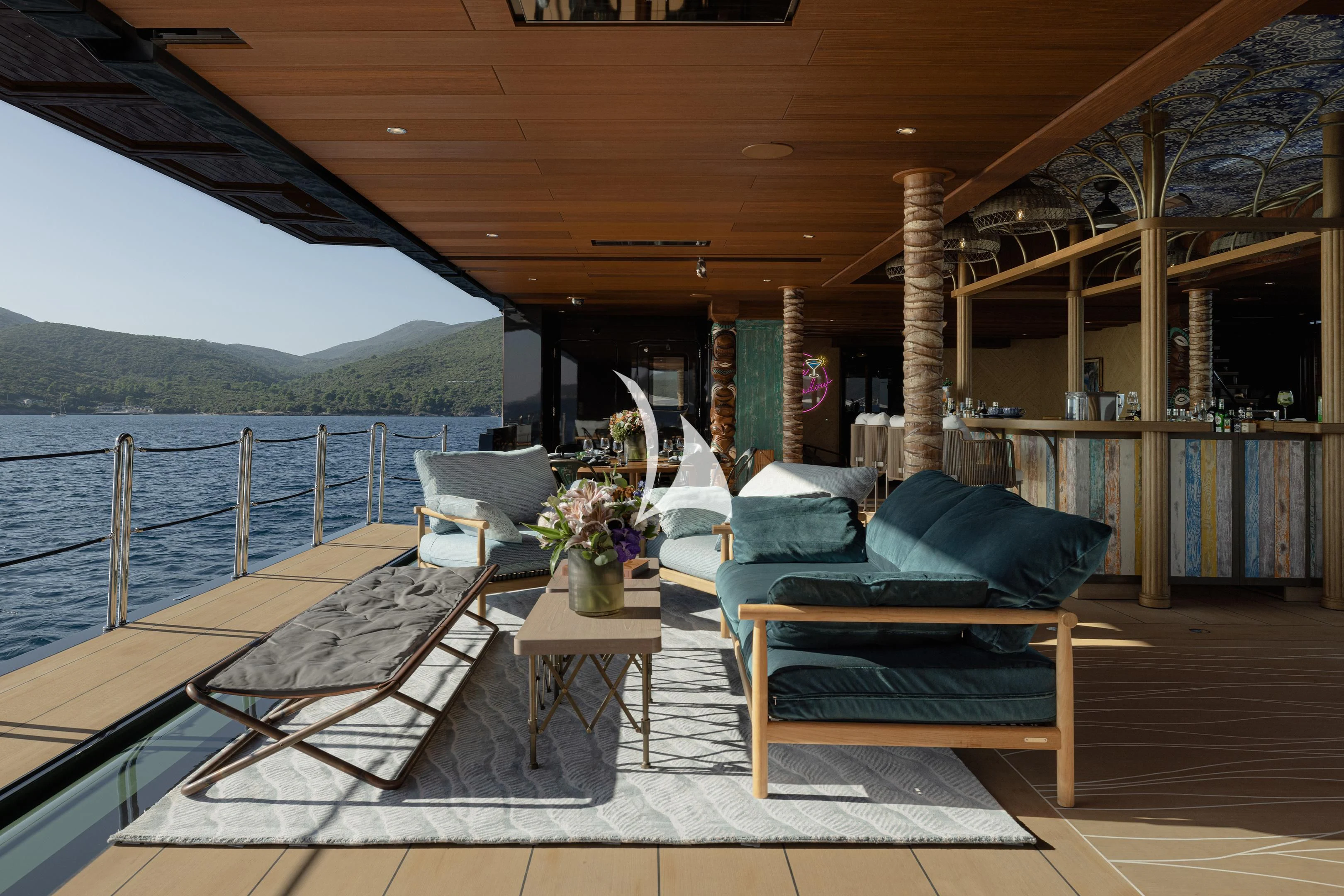 a deck with a table and chairs on it aboard PINK SHADOW Yacht for Sale
