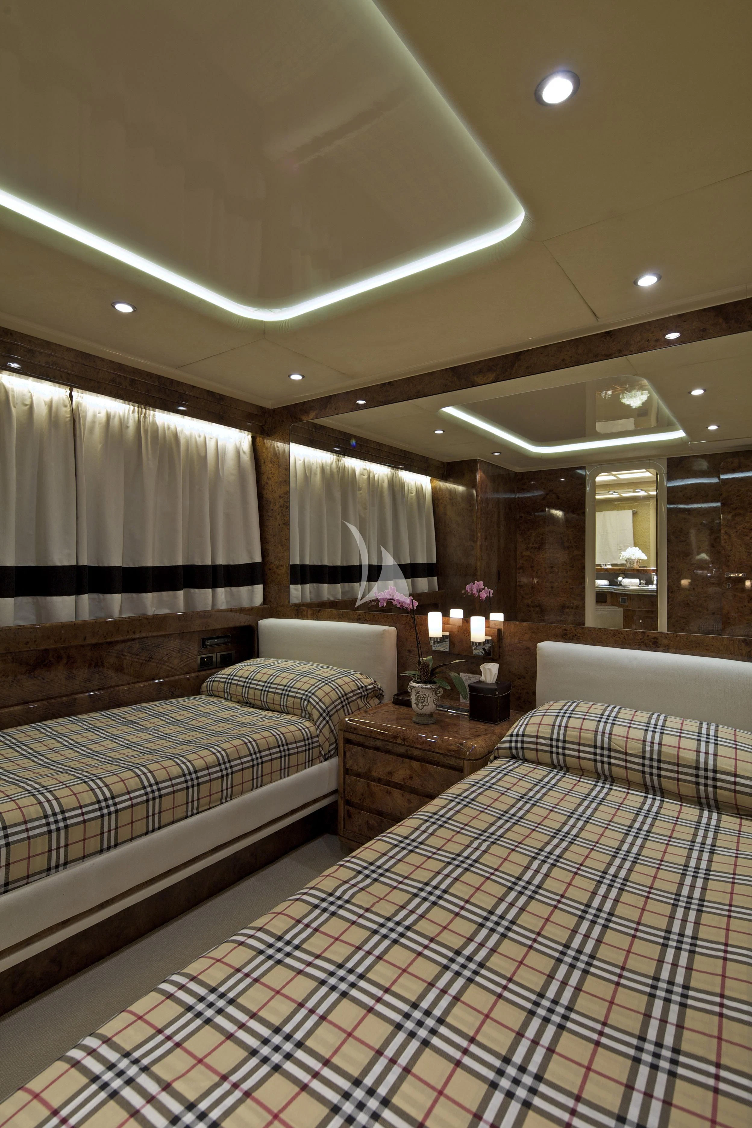 a couple of beds in a hotel room aboard OBSESION Yacht for Sale
