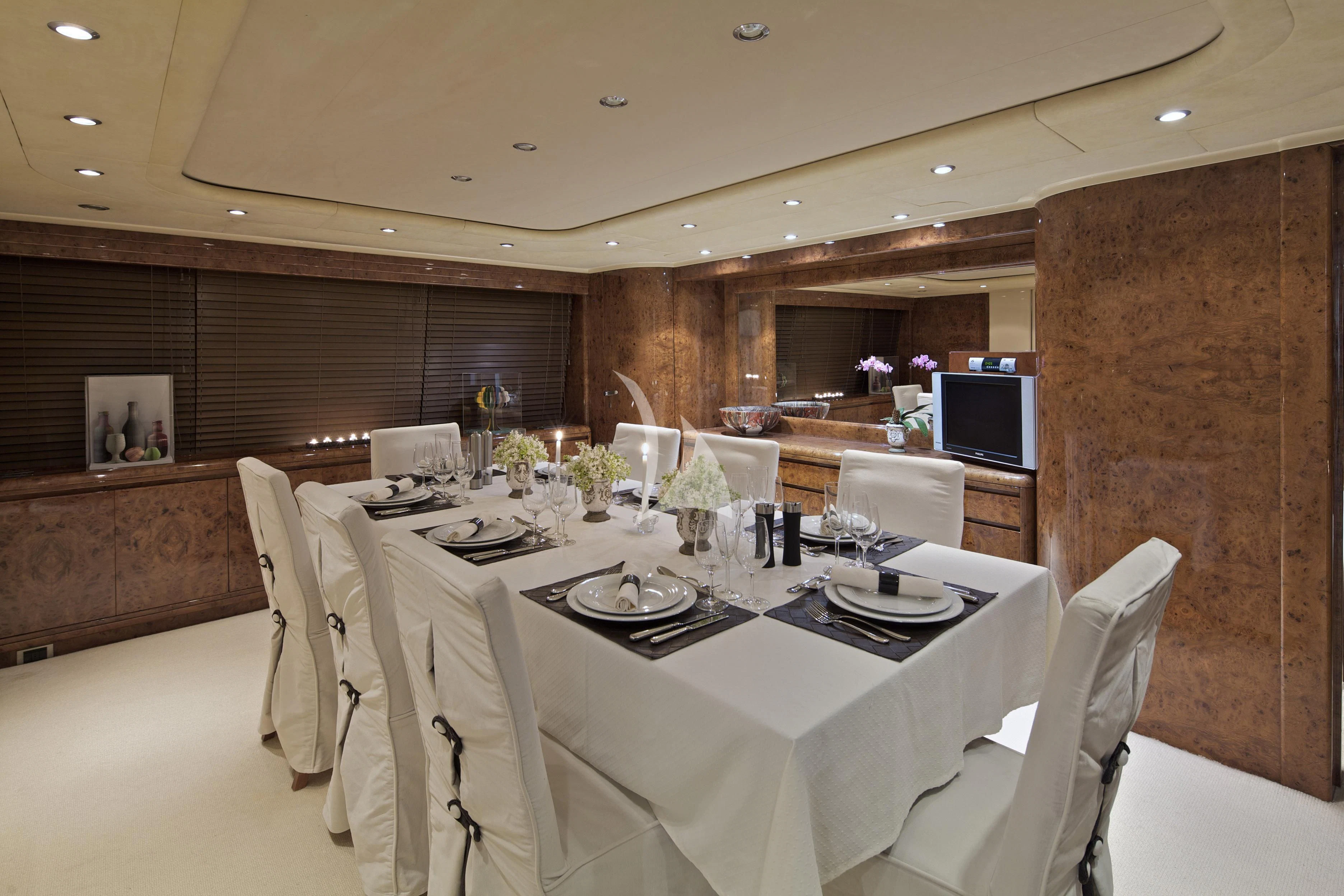 a large dining room with a table aboard OBSESION Yacht for Sale