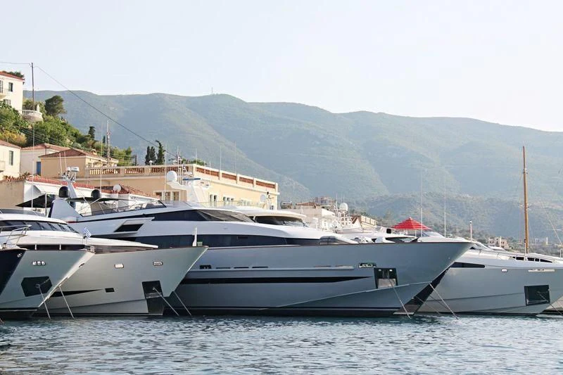 a couple of boats on the water aboard OBSESION Yacht for Sale