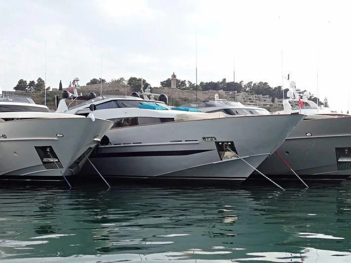 several boats docked at a pier aboard OBSESION Yacht for Sale