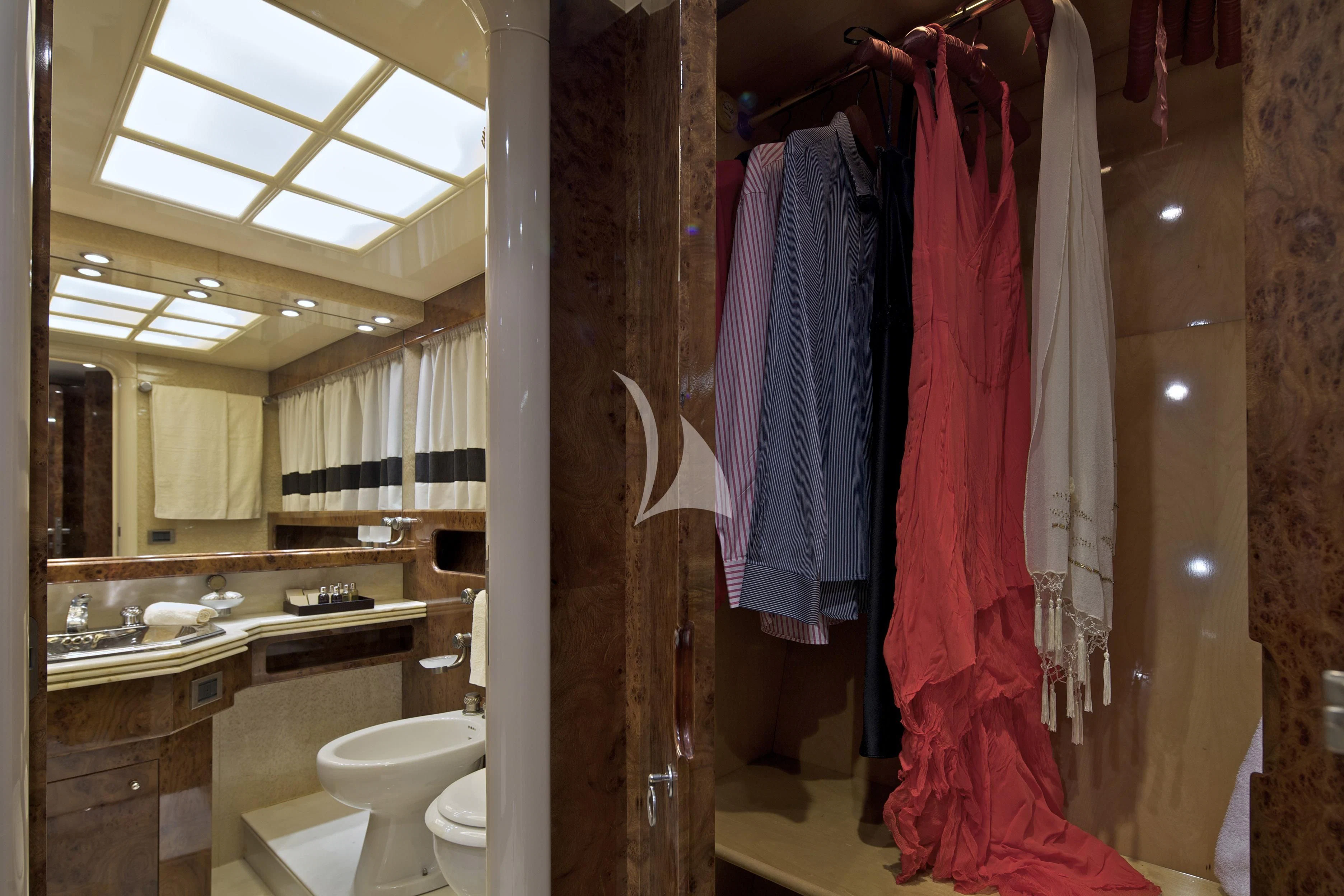 a bathroom with a red towel on the wall aboard OBSESION Yacht for Sale
