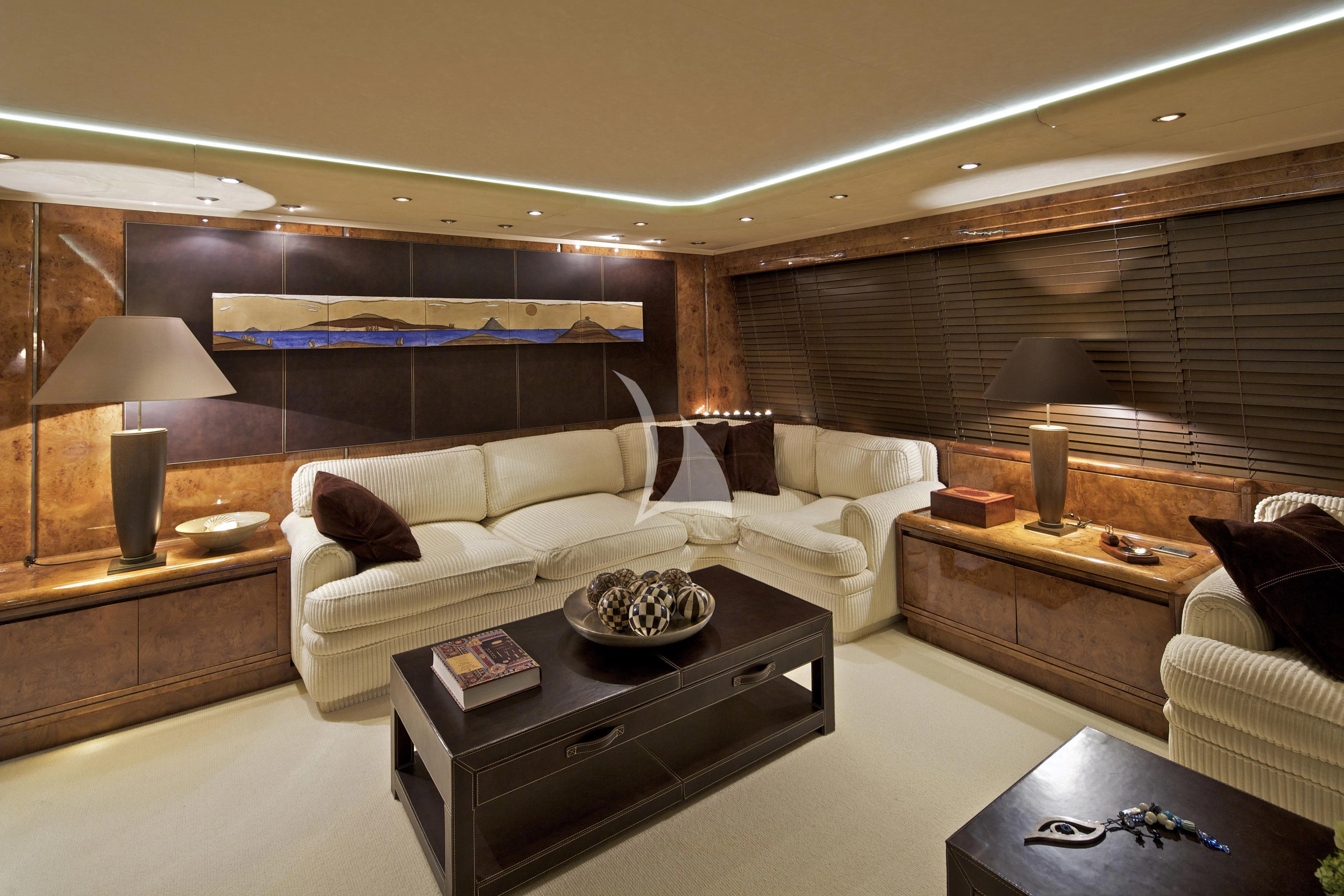 a living room with a large mirror aboard OBSESION Yacht for Sale