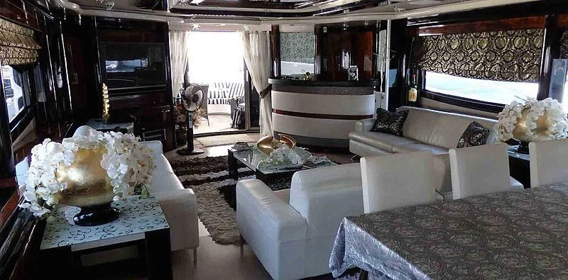 a living room with a large white piano and a large white piano aboard ETERNITY Yacht for Sale