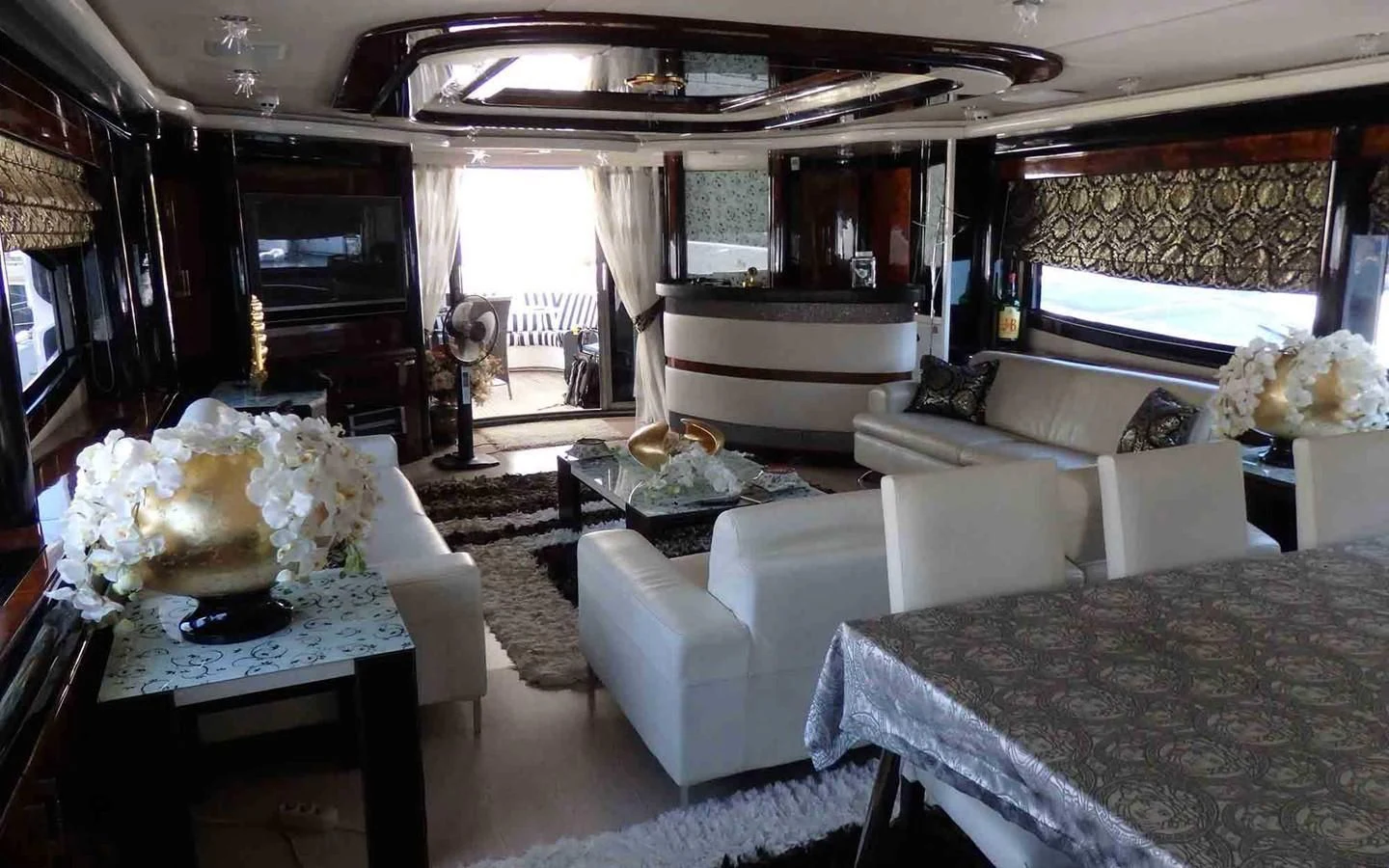 a living room with a piano aboard ETERNITY Yacht for Sale