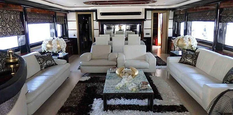 a living room with a couch and a coffee table aboard ETERNITY Yacht for Sale
