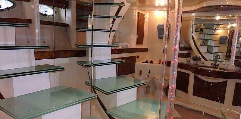 a large bathroom with a glass shower aboard ETERNITY Yacht for Sale