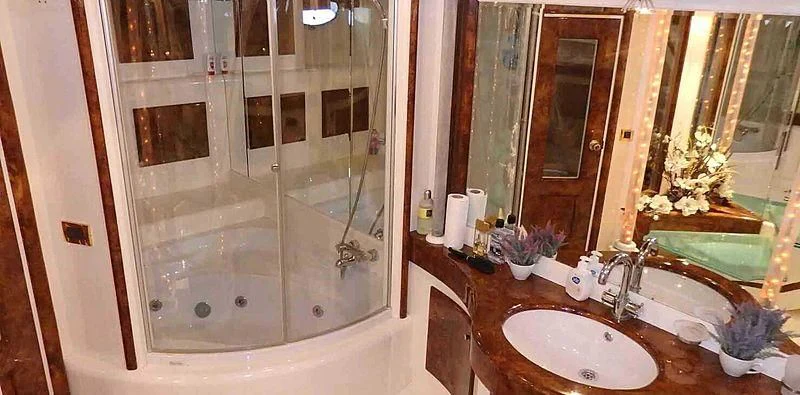 a bathroom with a glass shower aboard ETERNITY Yacht for Sale