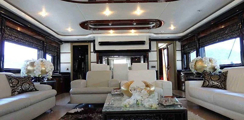 a living room with a large fireplace aboard ETERNITY Yacht for Sale