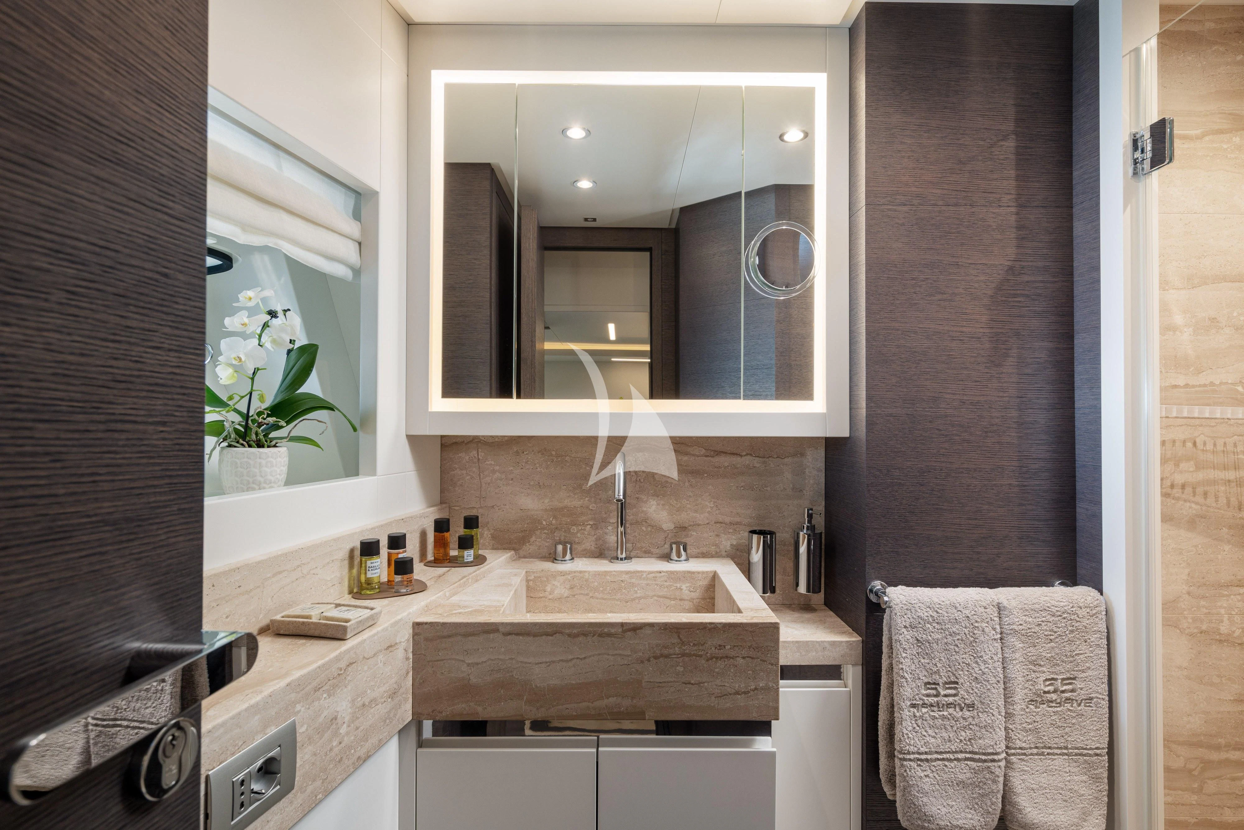 a bathroom with a sink and a mirror aboard 55 FIFTYFIVE Yacht for Charter