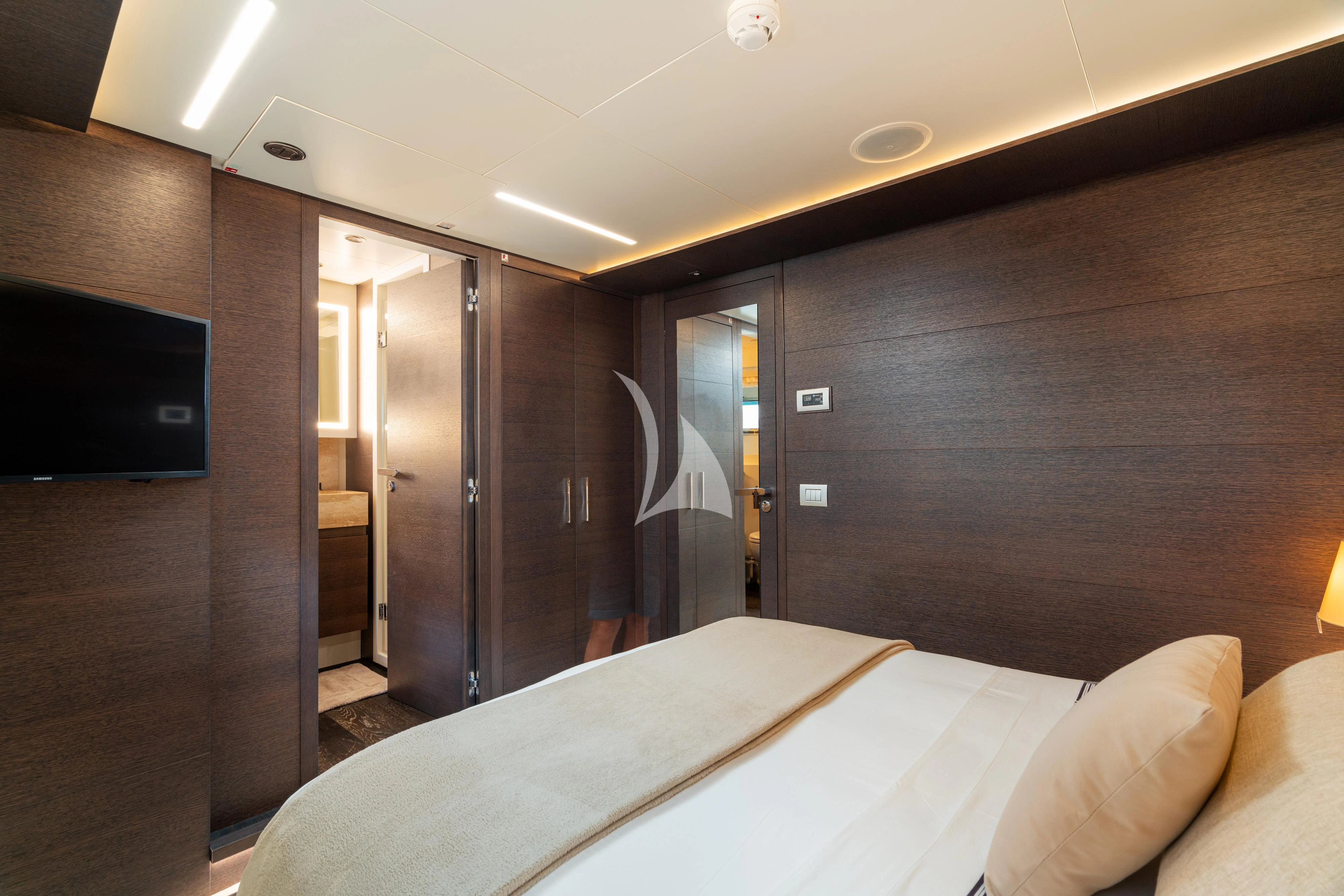 a hotel room with a bed aboard 55 FIFTYFIVE Yacht for Charter