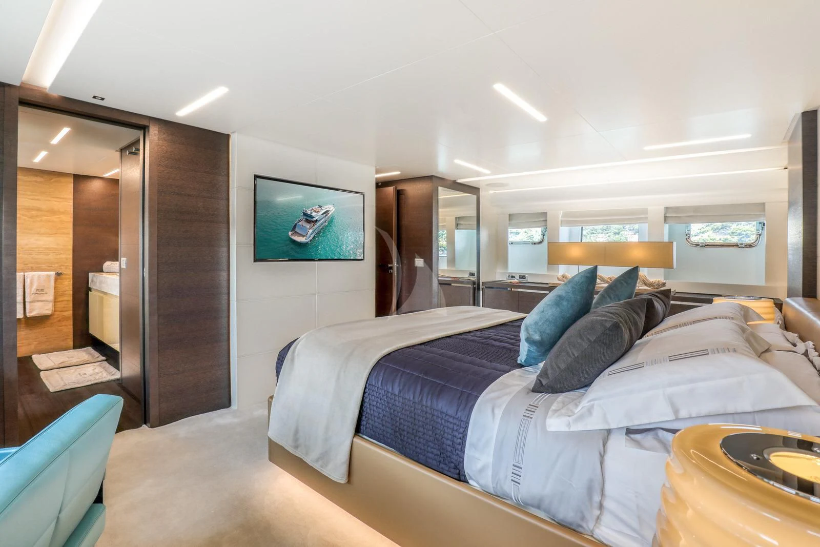 a bedroom with a bed and a television aboard 55 FIFTYFIVE Yacht for Charter