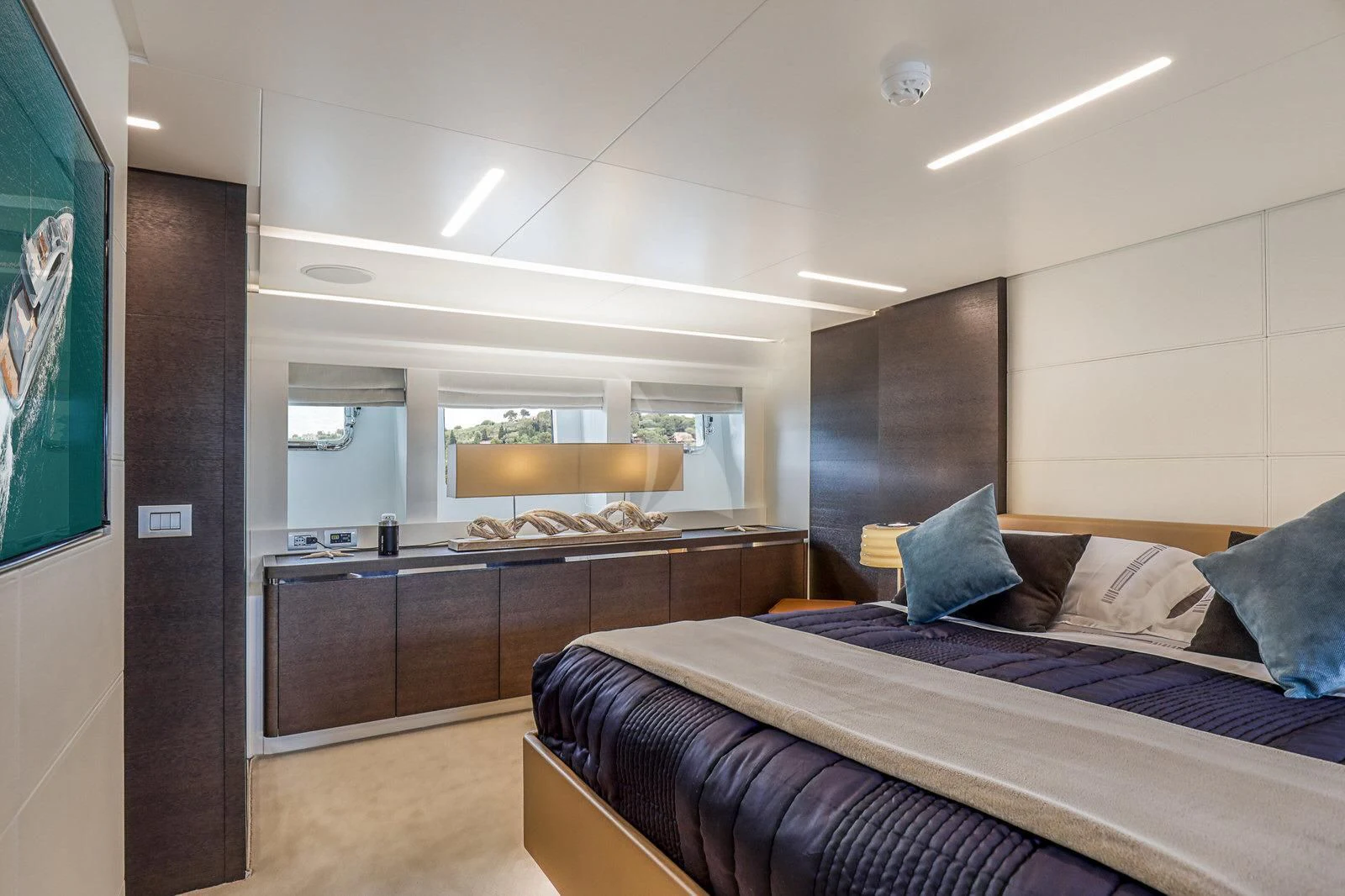 a bedroom with a bed and a desk aboard 55 FIFTYFIVE Yacht for Charter