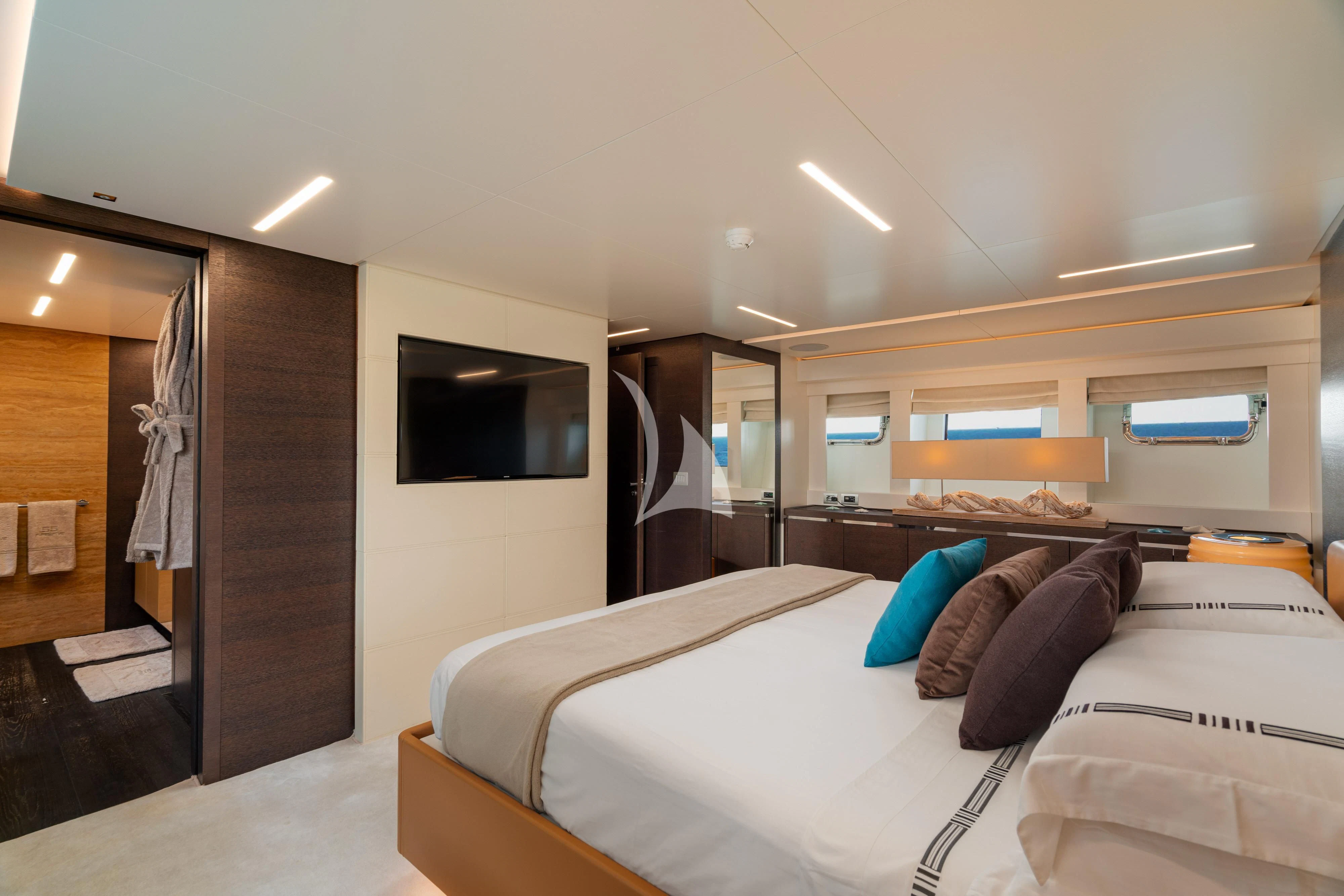 a bedroom with a bed and a television aboard 55 FIFTYFIVE Yacht for Charter