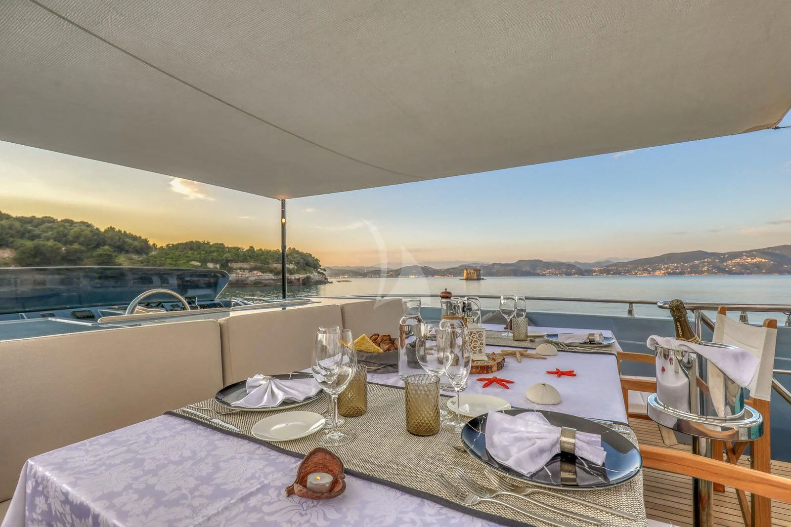 a table set for a dinner aboard 55 FIFTYFIVE Yacht for Charter