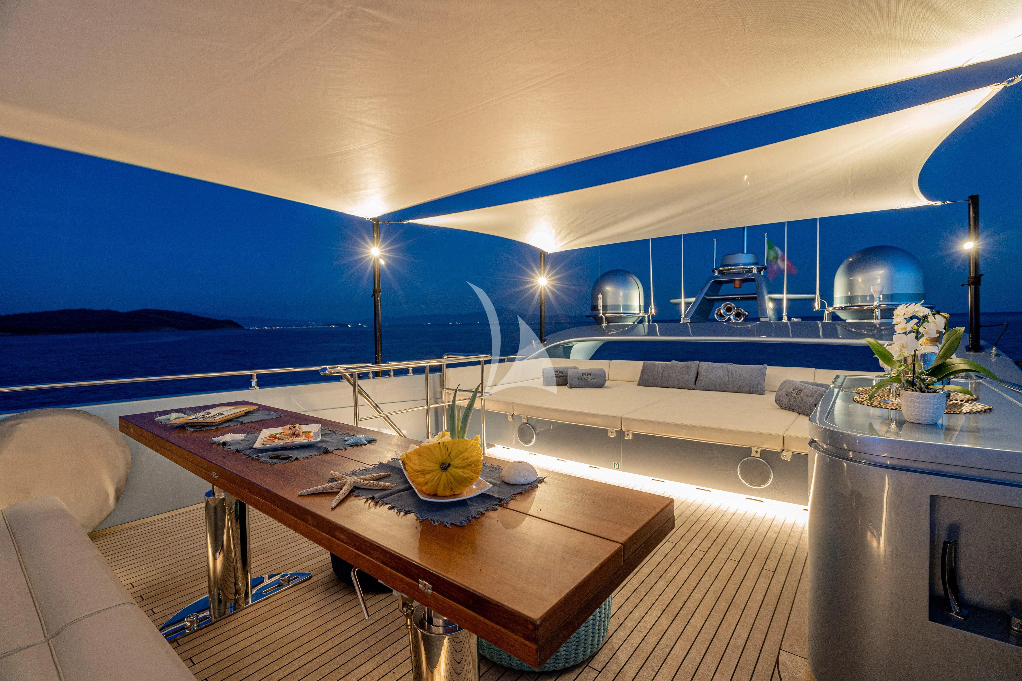 a room with a table and a bed aboard 55 FIFTYFIVE Yacht for Charter