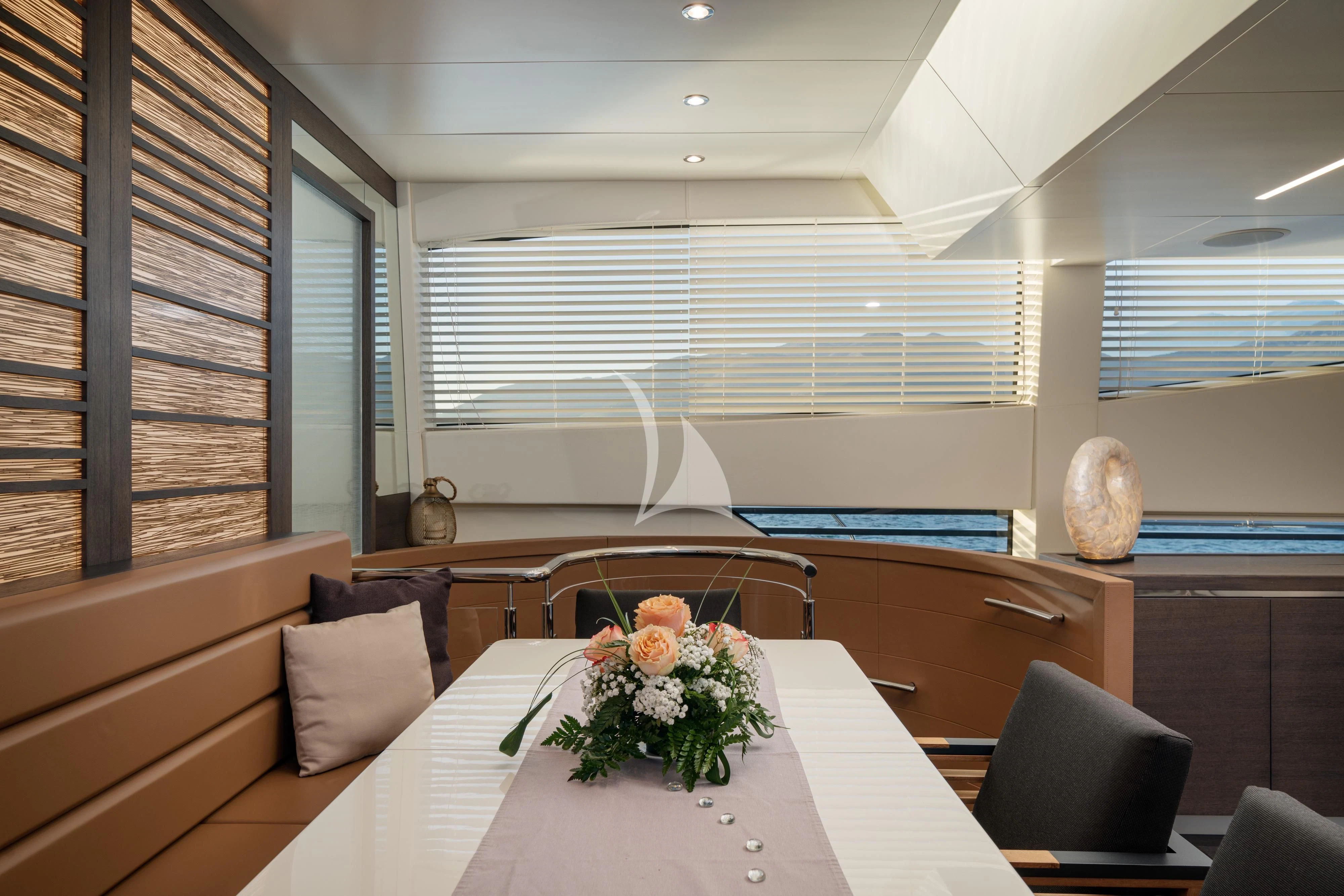a room with a table and chairs aboard 55 FIFTYFIVE Yacht for Charter
