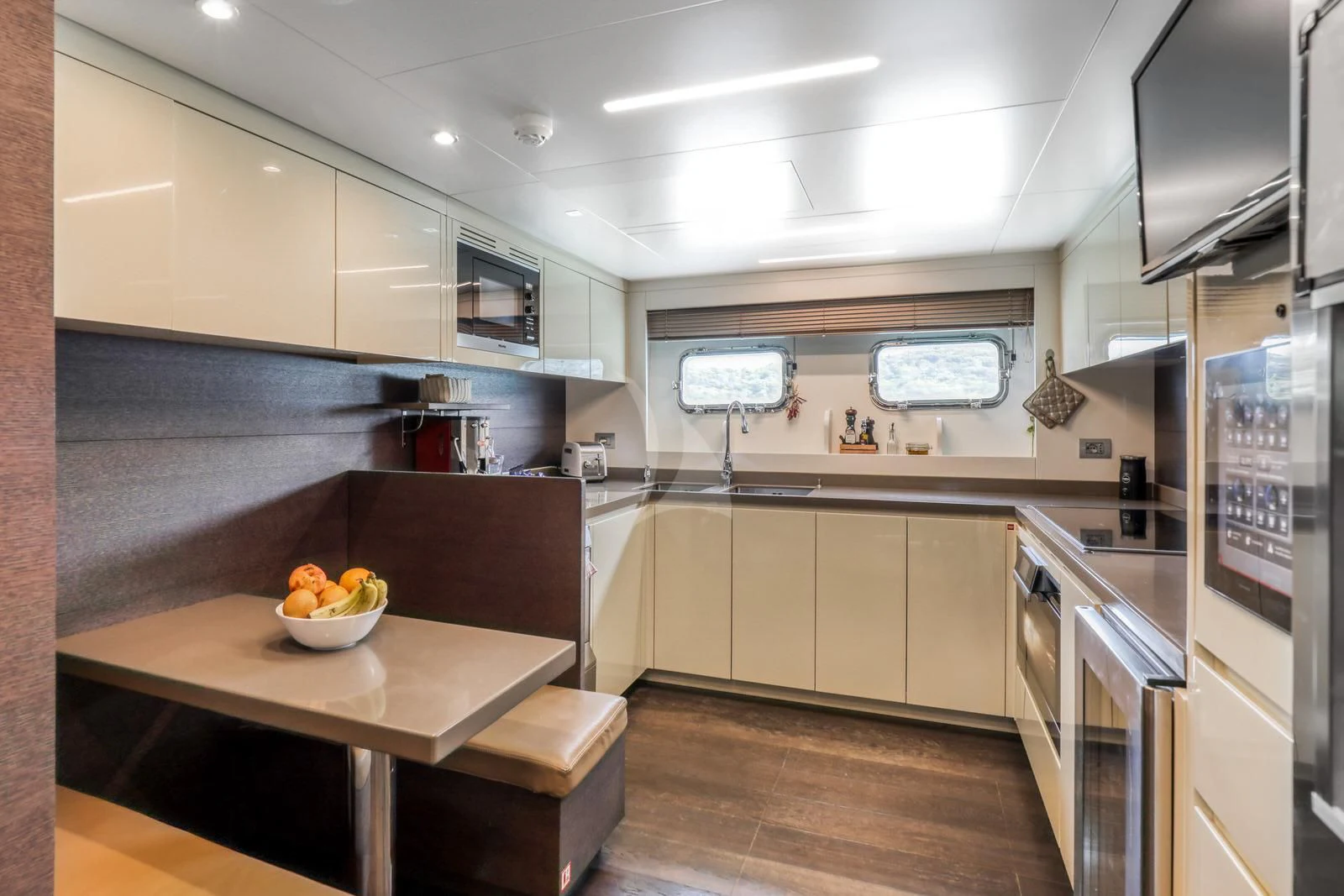 a kitchen with a bowl of fruit aboard 55 FIFTYFIVE Yacht for Charter