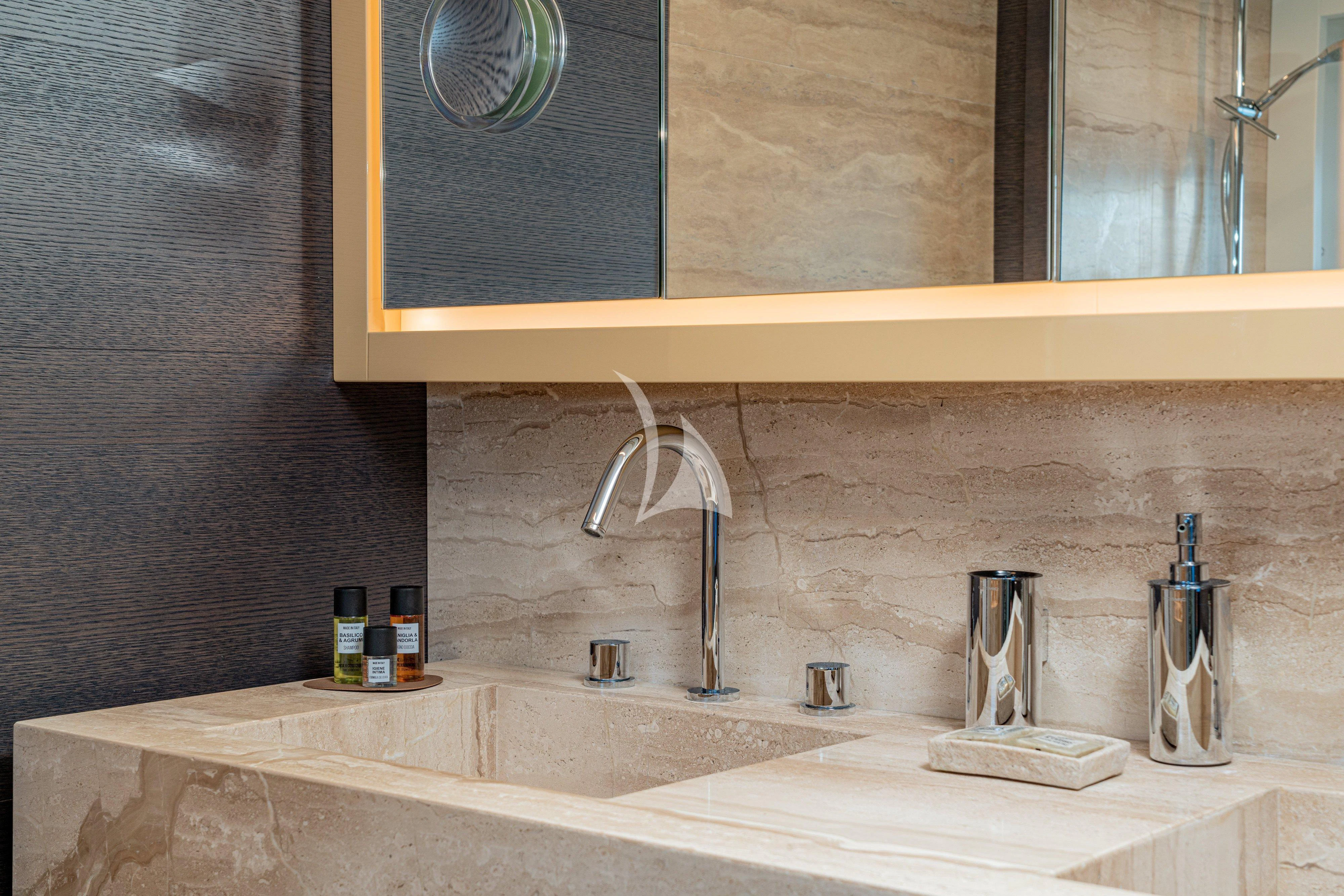 a bathroom with a sink and a mirror aboard 55 FIFTYFIVE Yacht for Charter