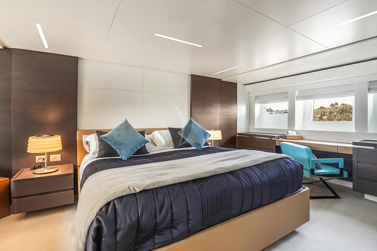 a bedroom with a bed and a desk aboard 55 FIFTYFIVE Yacht for Charter