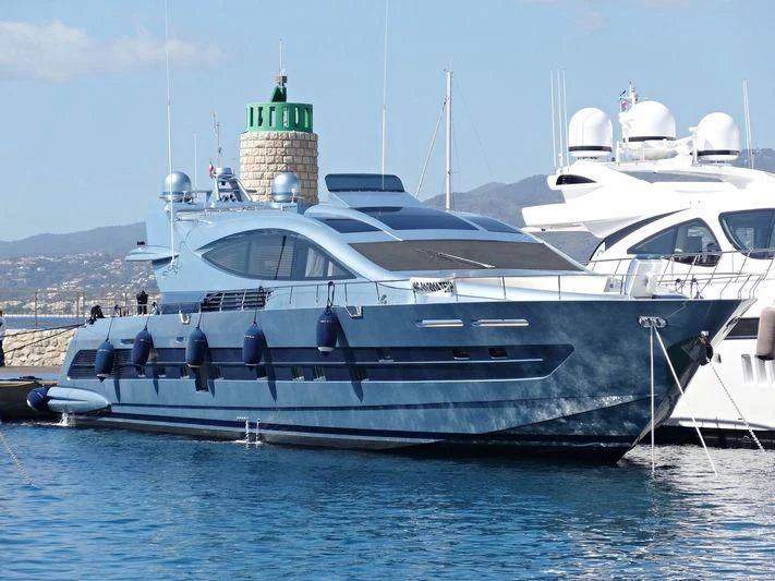 a large white boat in the water aboard 55 FIFTYFIVE Yacht for Charter