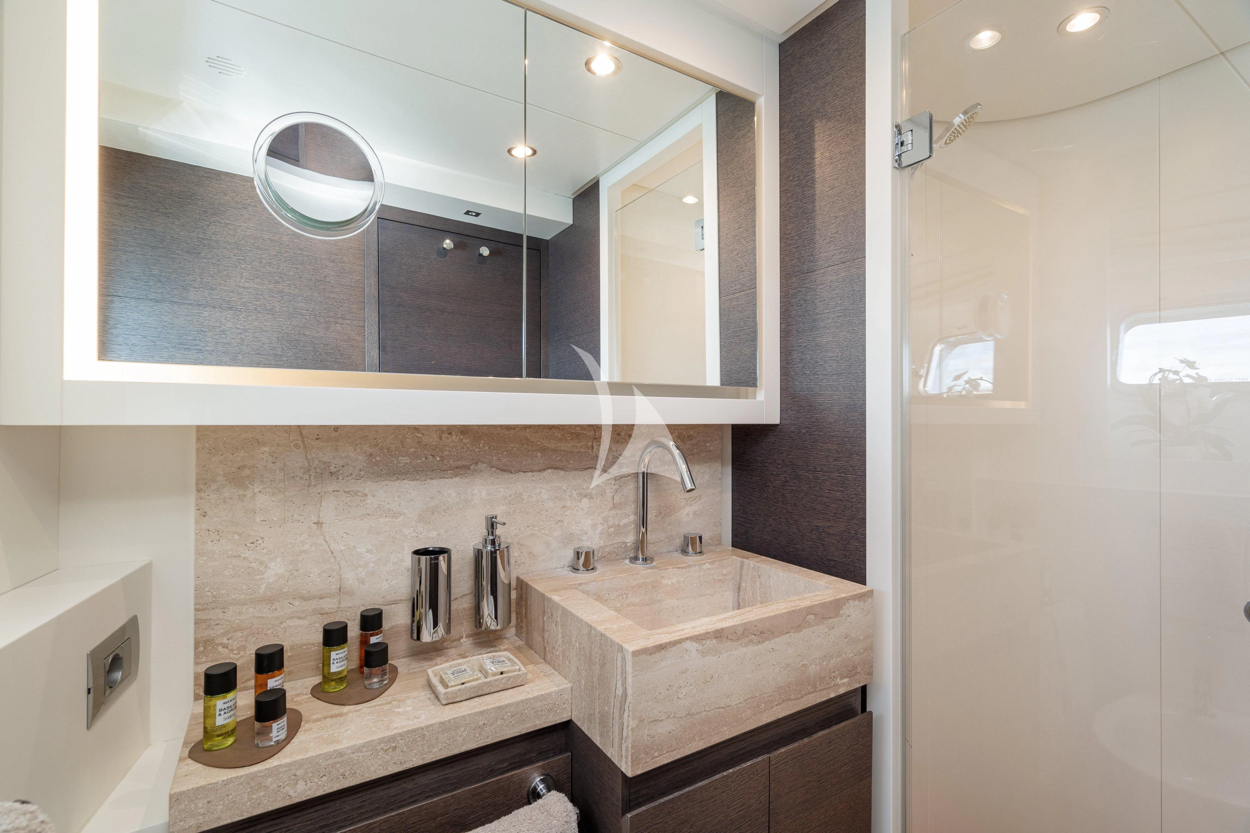 a bathroom with a large mirror aboard 55 FIFTYFIVE Yacht for Charter